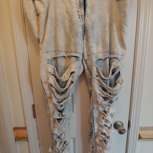 Distressed faded jeans
